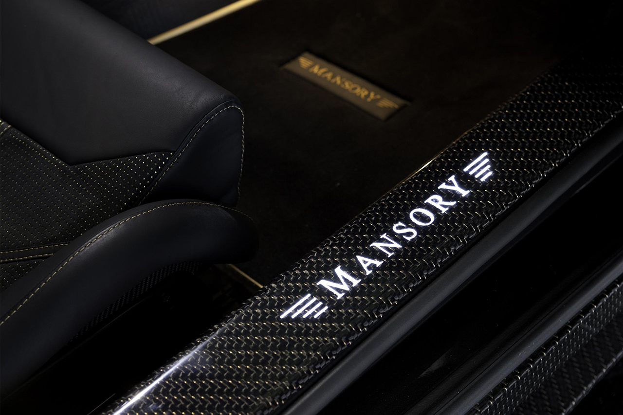 mansory aston martin db9 cyrus wide body carbon fiber interior illuminated logo